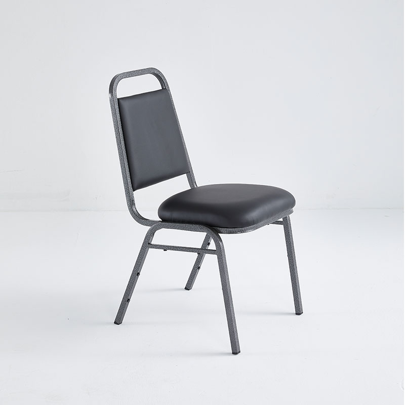 Economic banquet stacking chair with black vinyl upholstery and a metal frame.