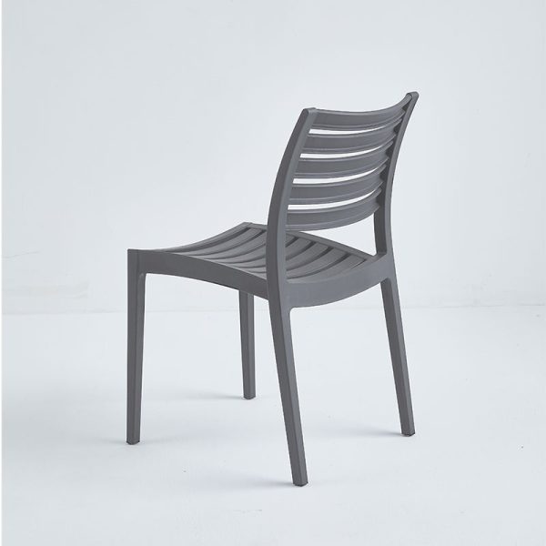 Photo of the back of a gray polypropylene plastic patio chair.